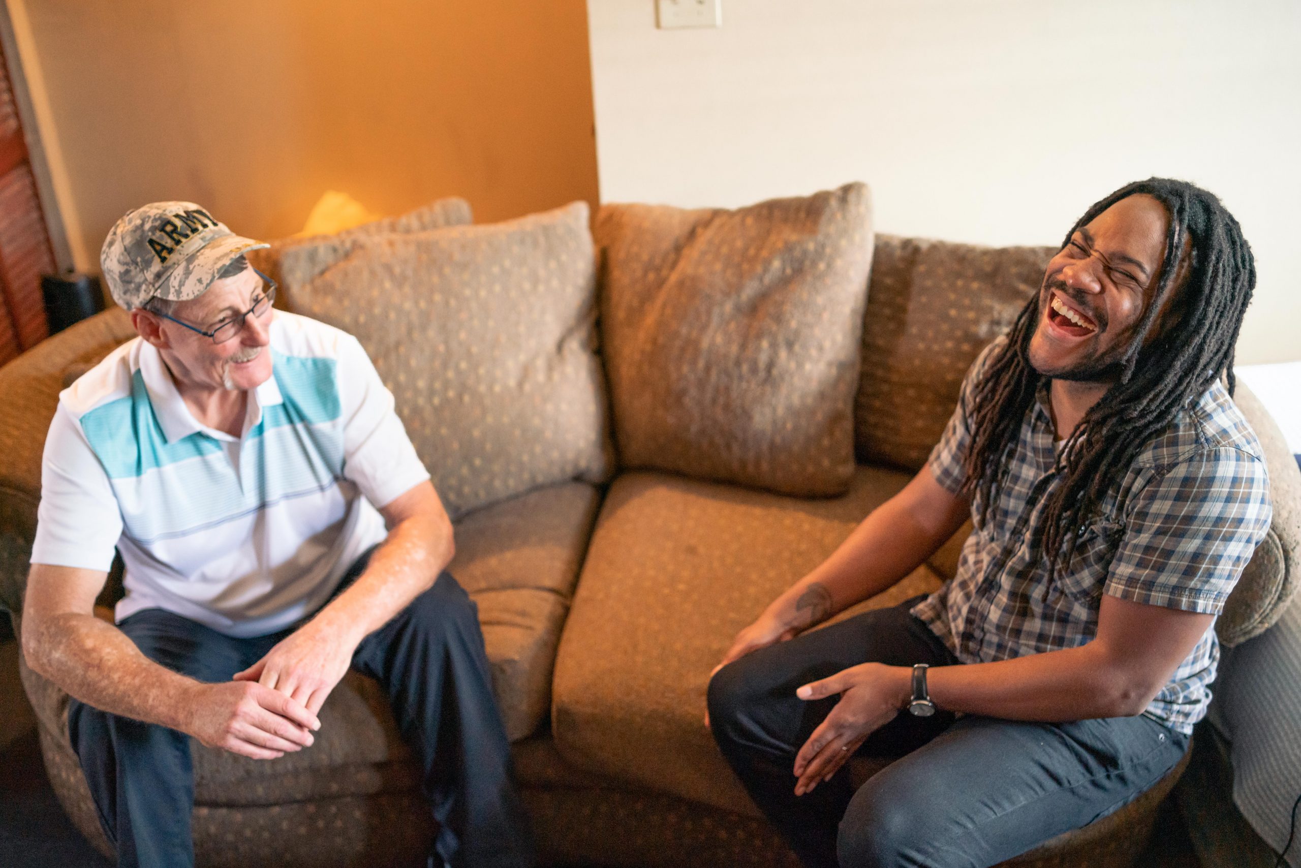 Former IDignity clients Chris and Rahsaan laughing over a conversation together.